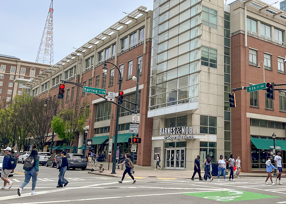 People crossing at the intersection of Spring and 5th.